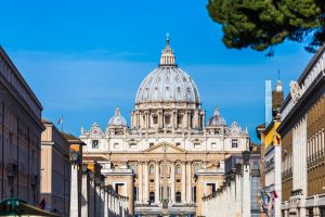 Tourism and sightseeing, view over famous St. Peter's Basilica, Vatican City from Road of the Conciliation, summer day, blue sky
